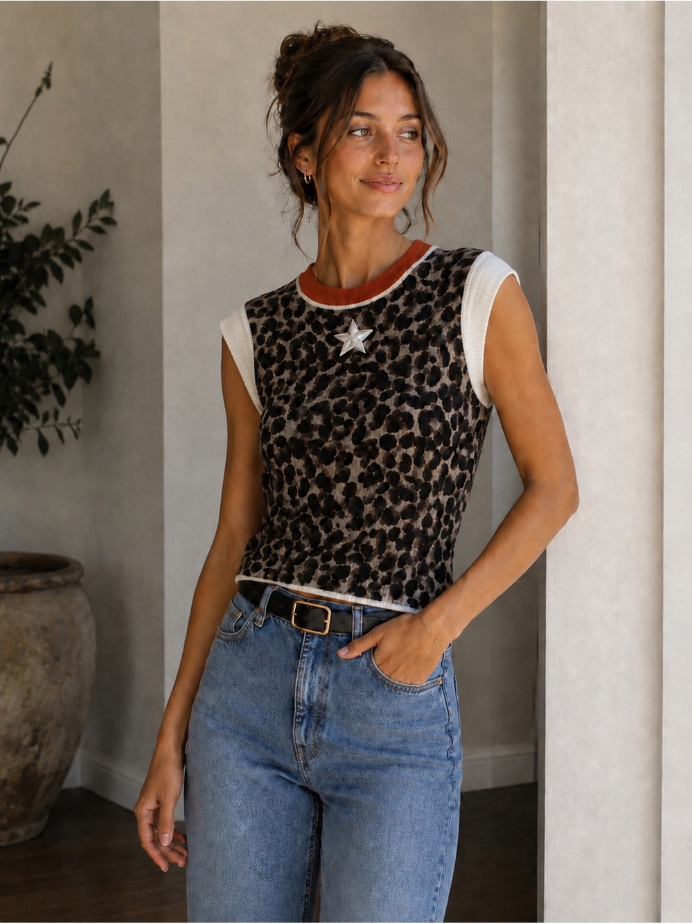 Leopard Print Sleeveless sweater top with white Star Patch and Orange neck rim.